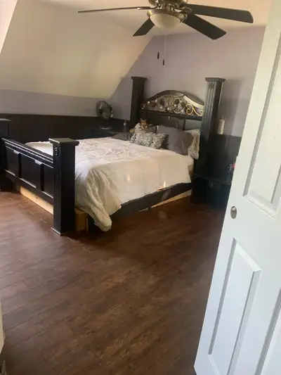 Large master bedroom with two large closets this bedroom is upstairs and there are two dogs and two...