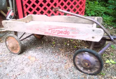 Vintage 60 year old Torpedo wagon. The rear wheels are rusted but all wheels are solid and work well...