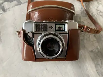 German made AGFA Optima 1A 35 mm camera with saddle brown case. Made in the early 1960's. A very vin...