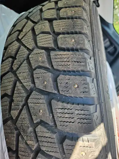 Studded sumitomo Ice Edge Michelin winter tires. Size 246/60R18. Theses tires are mounted on black s...