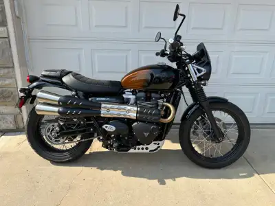2024 Triumph Scrambler 900, Stealth Edition. It has the Factory Custom Orange fade to Black painted...