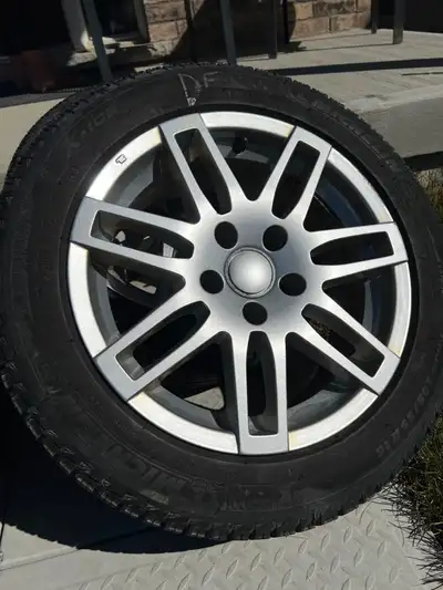 Four 16x7 alloy wheels (RS4 replica) with Michelin X-Ice Xi3 winter tires mounted. • Tire size: 205/...