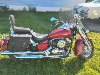 This motorcycle comes equipped with leather saddle bags, two-up seat, windshield and brand new batte...