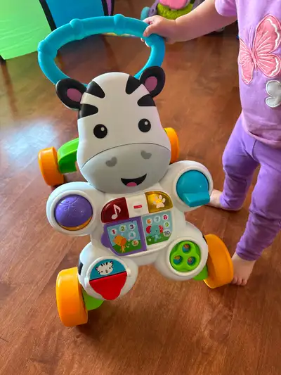 Fisher price zebra baby walker in good condition, to help your little one learn to walk. No pet non...