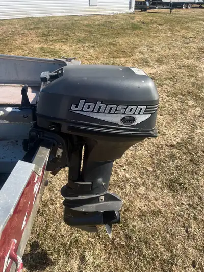 2002 Lund adventure 14 foot aluminum boat with a 15 horse power Johnson outboard motor and a Karavan...