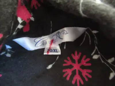 A pair of Claudel Women's pajamas. Black with some snowflakes and cardinal birds. The tags have been...