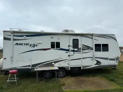 Selling my used 2012 Arctic Fox 25R travel trailer, perfect for family adventures with a spacious in...