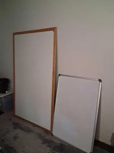 I'm offering two used white boards. One is larger with a wooden frame, the other is smaller with a m...