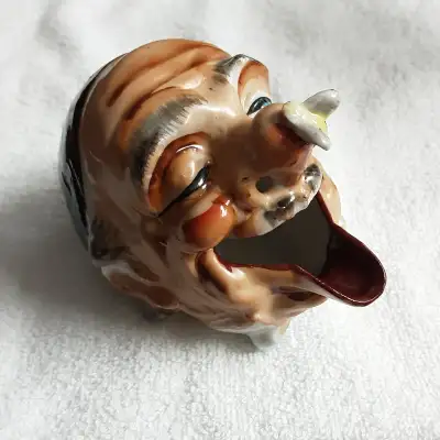 3" wide x 3.5" high x 4" long. Hand formed and decorated. From our Ashtray collector this piece was...