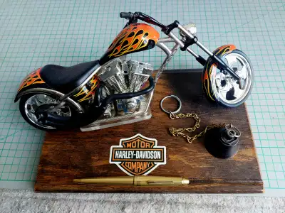 This is a one-of-a-kind, Harley-Davidson custom Sportster model mounted on reclaimed 1920s oak hardw...