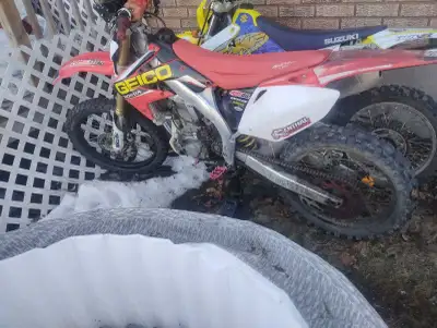 I'm selling my Honda CRF450R motocross bike, a powerful and agile machine designed for competitive r...