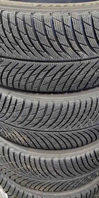 One set of four 2024 almost brand new Michelin Pilot Alpin 5 SUV winter tires for sale. Tires size i...
