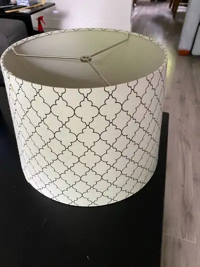 This is a drum lamp shade with a modern lattice pattern, sized 12 inches in diameter and 10 inches i...