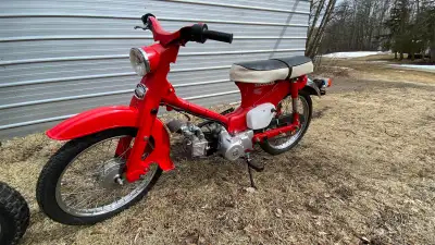 1965 Honda c100 cub. It has a 110cc engine with a fully automatic transmission and electric start. H...