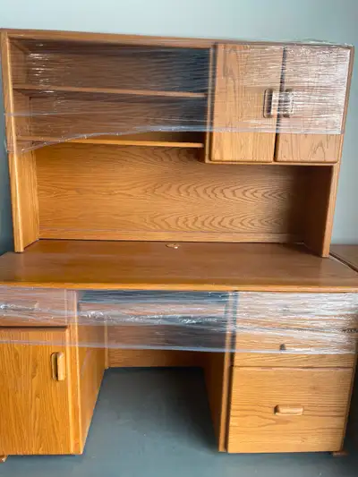 Offering office desk with hutch, $100, file cabinet $30 and rolling desk chair $30. All in good cond...
