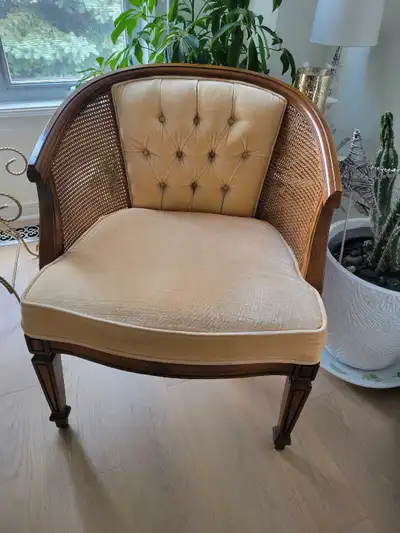 2 cane and wood upholstered chairs