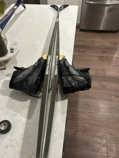 cross country skis and boots with poles, View more