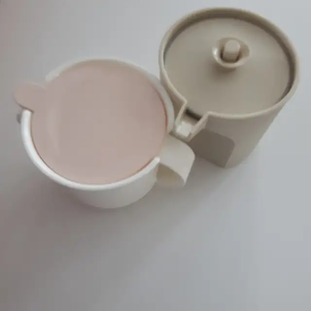 5 NEW TUPPERWARE ITEMS: 2 SUGAR BOWLS, 1 CREAMER, 1 500 ML CONTAINER (6 INCHES HIGH), 1 8X12 INCH SERVING PLATE, AND 1 LID HOLDER: $5.00 EACH
