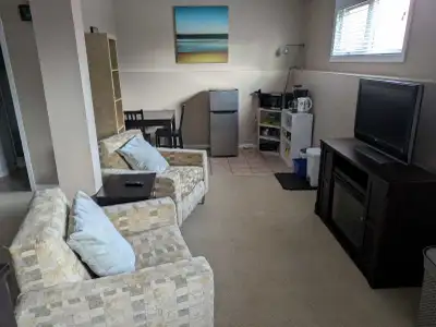 Furnished basement suite (queen sized bed) for rent in a shared rental. $1000/month & $1000 damage d...