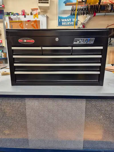 Metal storge box. 26 inches wide , 12 inches deep, ~15.5 inches high. Drawers run smooth. Lock and k...