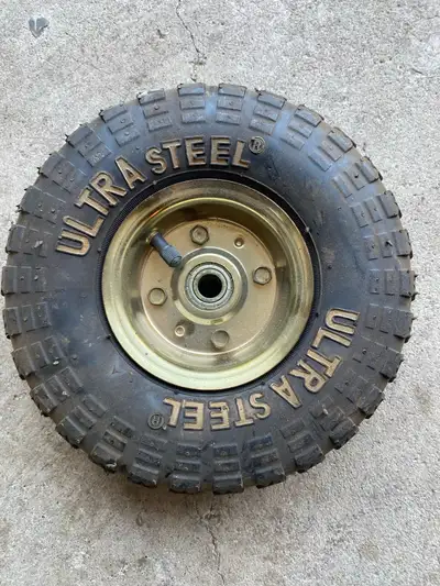 This Ultra Steel tire, sized at 4.10/3.50-4, is in used condition. It features a durable constructio...