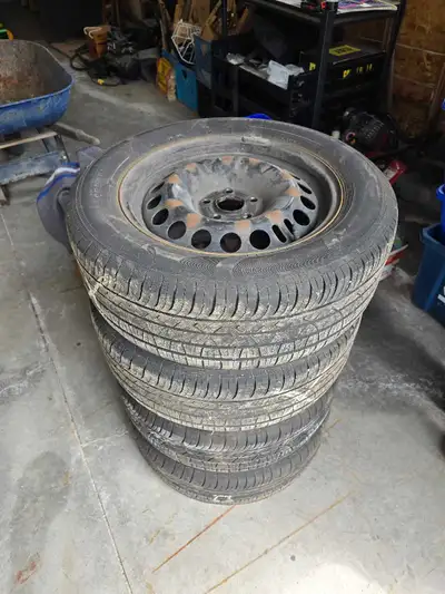 These used Chevrolet Cruze tires and steel rims are in used condition, showing normal wear from prev...