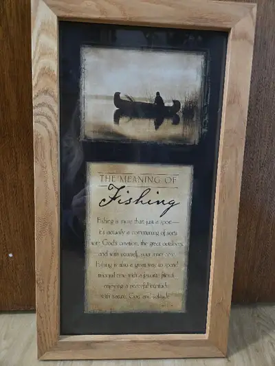 A peaceful & tranquil picture of a fisherman in a canoe Beneath the picture is a lovely inscription...