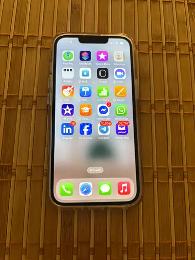 Apple IPhone 13 in an excellent condition and a clear case, View more