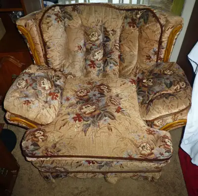 Pillow cushion style living room chair with wood trim in good condition for sale.
