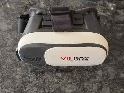 Experience immersive 3D movies and gaming with this VR Box 2.0 headset. Simply slide your smartphone...