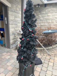 2 light up black christmas trees