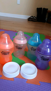 9 ounce tommee tippee bottles and 2 covers