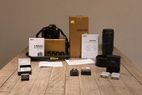 Nikon D5500,  batteries + Nikon 70-200 f/4; blank warranty forms