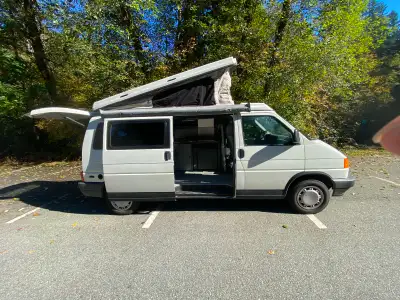 BC WHY THIS ONE IS SPECIAL • Original Winnebago camper conversion • Pop-top roof with upper sleeping...