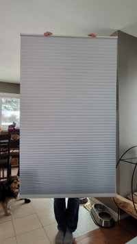 Used grey cellular blinds