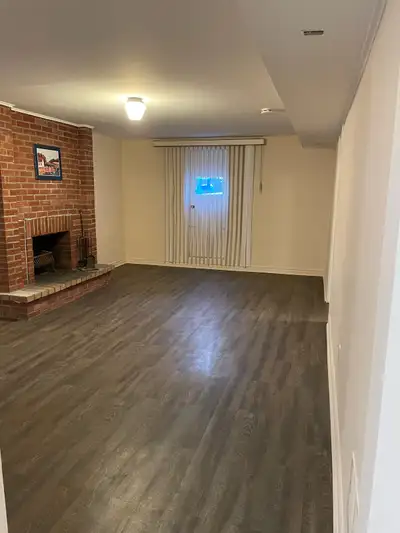 This cozy and clean basement apartment features a spacious open-concept living area with a beautiful...