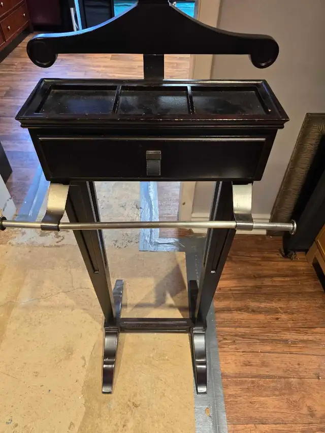 Dark wood valet stand