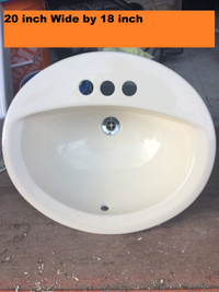 20 inch Wide by 18 inch Oval Bathroom Sink with drain attached