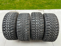 4 Vision Rocker Matte Black 24" Rims with Haida Mud Champ tires