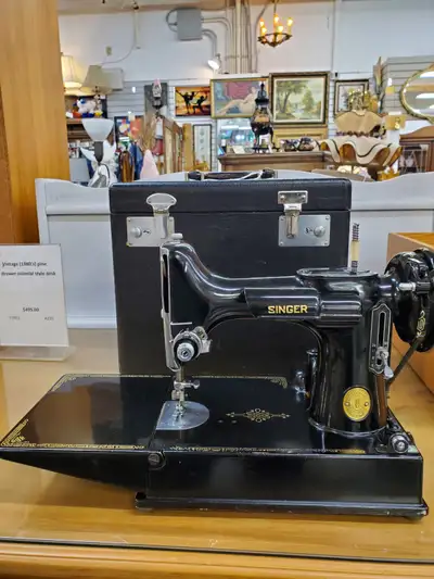1949 Singer Featherweight 221 sewing machine, carrying case and accessories. Serial #AJ207211 commis...