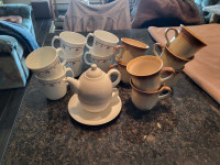 MUGS ..TEAPOT WITH CUP& SAUCER & INDOOR GRILL ..NEVER BEEN USED.
