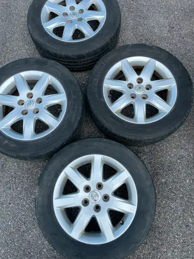 For sale are 4 original Toyota alloy rims with Michelin Harmony All season tires Three to four seaso...