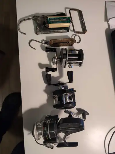 Vintage fishing reels and scales, View more