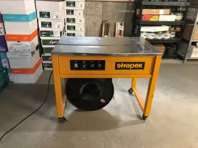 Strpaex Strapping Machine Model ES-102 Comes with a full roll of strapping