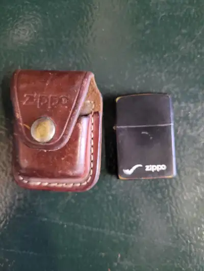 1988 zippo cigar light with case. No flint. Dry for simetime 60.00 Disney lounge fly leatger change...