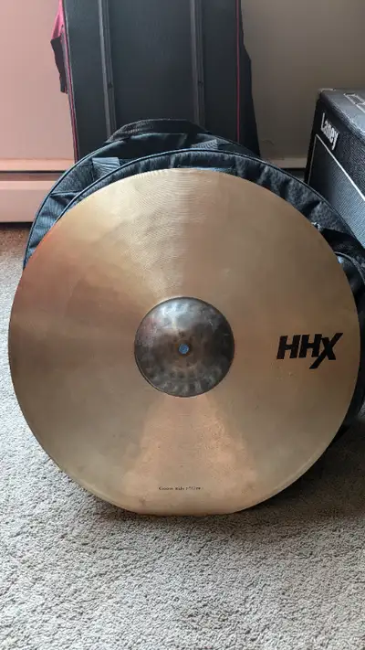 This is a used Sabian HHX Groove Ride 21". It's in good condition and sound great. Always well taken...