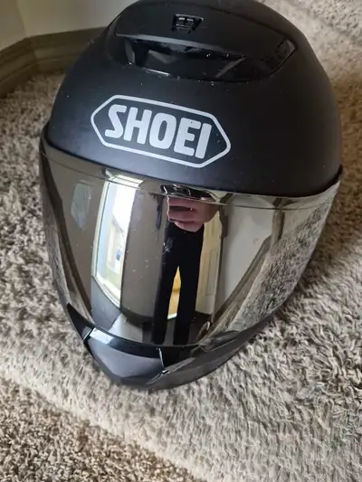 Xl Shoei Helmet in matte black. Has a clear visor and a silver iridium visor. Has multiple vents thr...