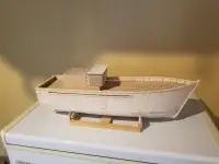 unfinished wooden model fishing boat