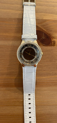 Fossil ladies watch - black face, gold rim, white leather strap