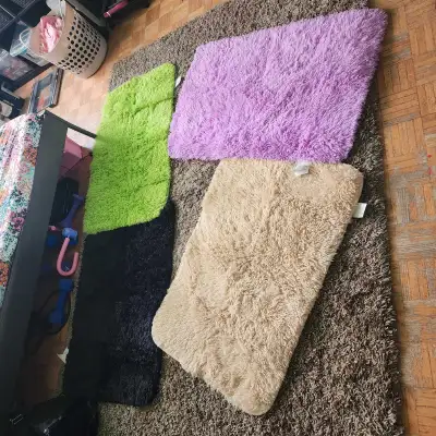 4 brand new throw rugs .washable 